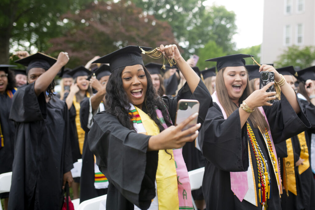 Graduates record the turning of tassels