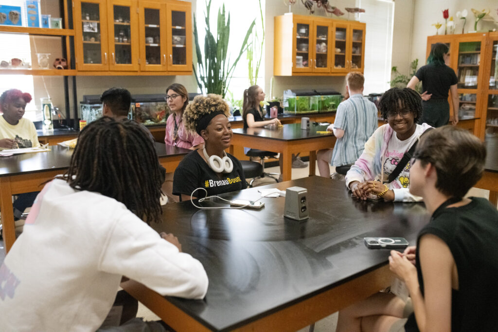 students sitting in the science building