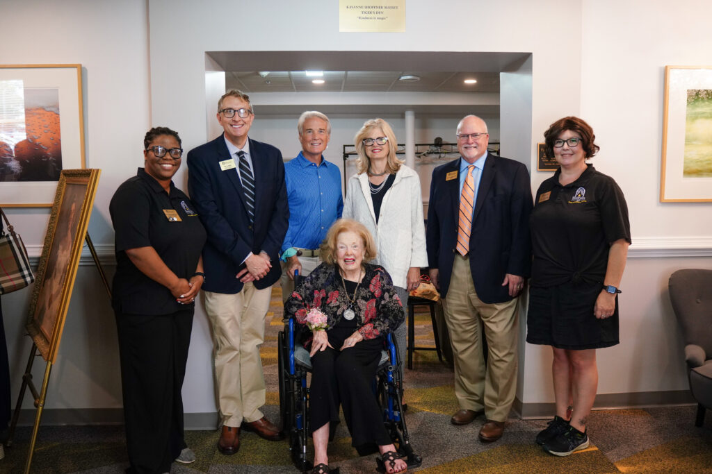 Brenau administrators and the Masseys pose for a photo.