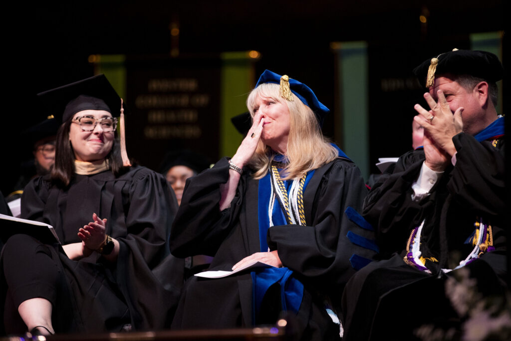 Dr. Dobkins blows a kiss to her students