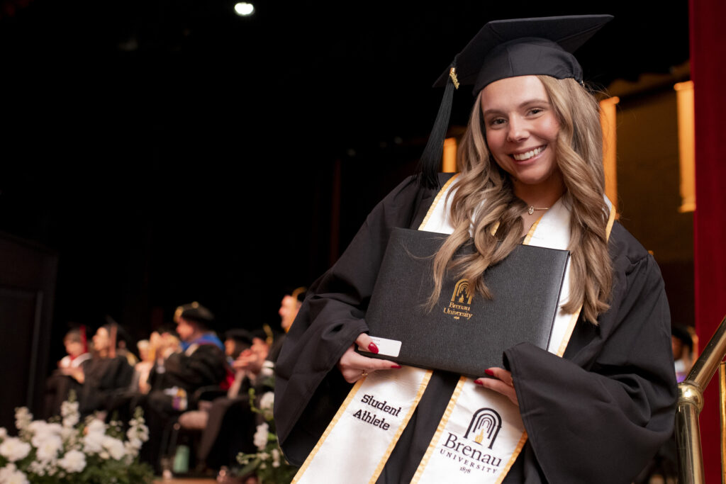 An undergrad student athlete with her degree
