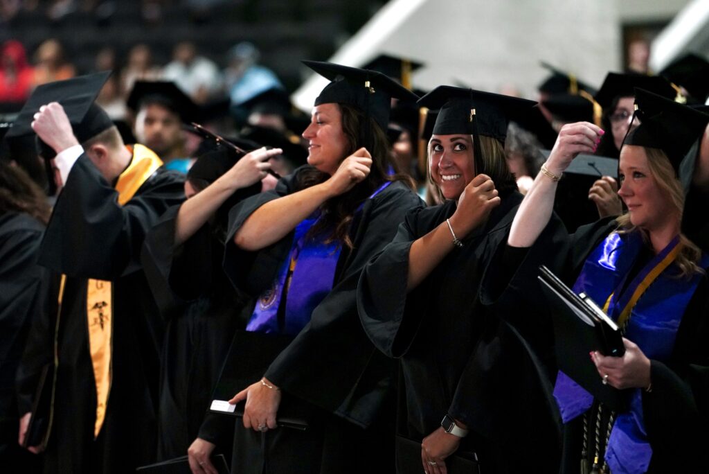 students turn their tassels