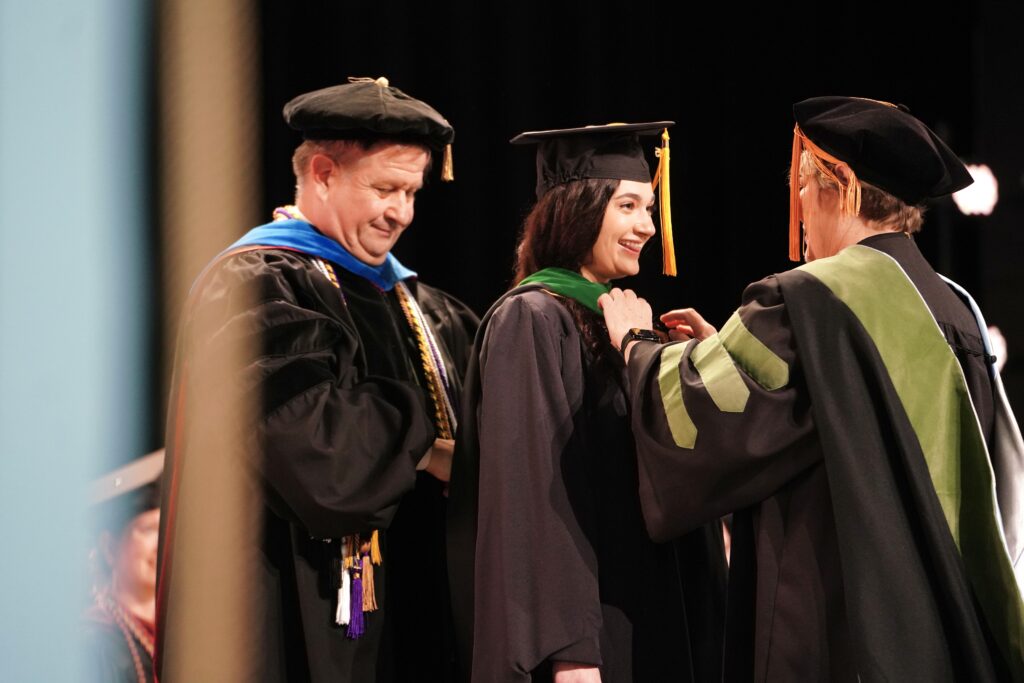 a graduate student getting her hood