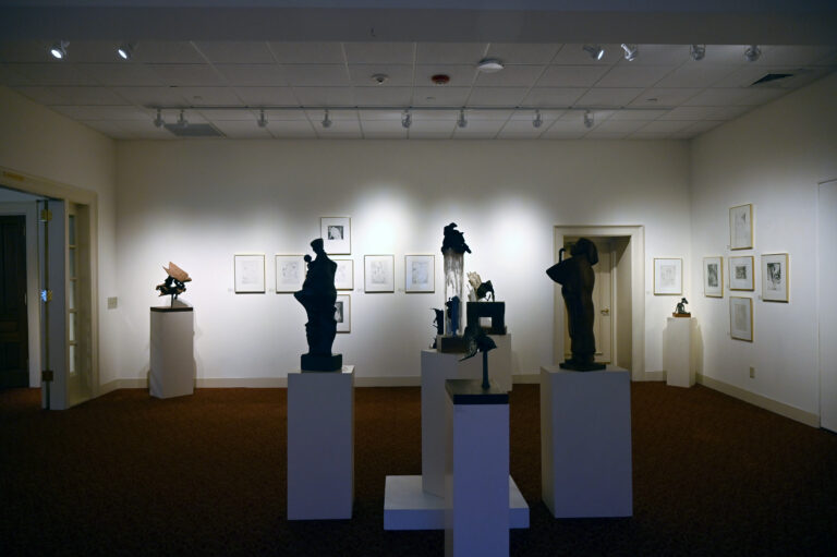 Exhibit of scuplture and prints in art gallery