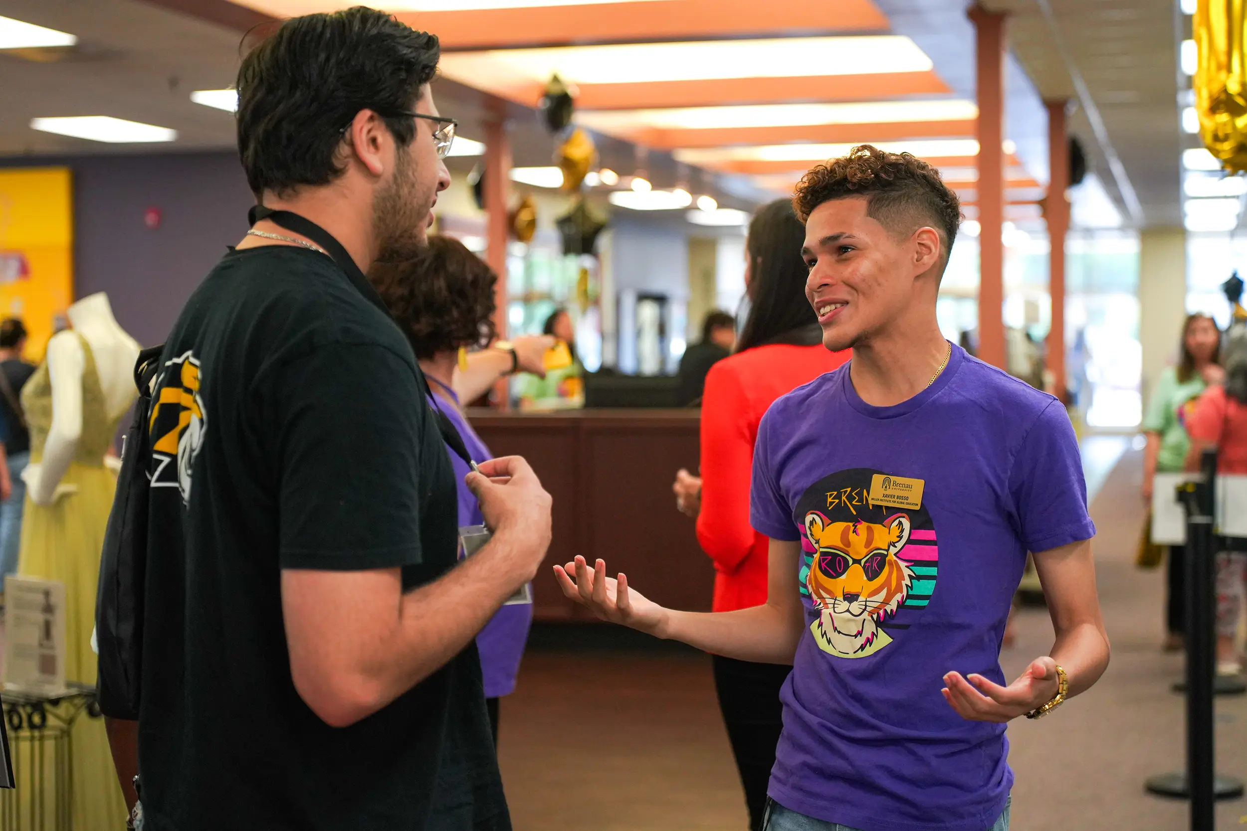 International student talking with another student