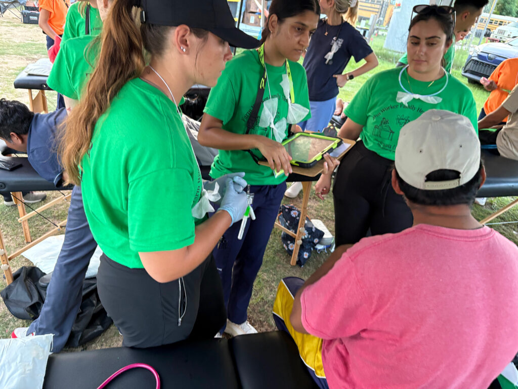 PT students work with a farmworker