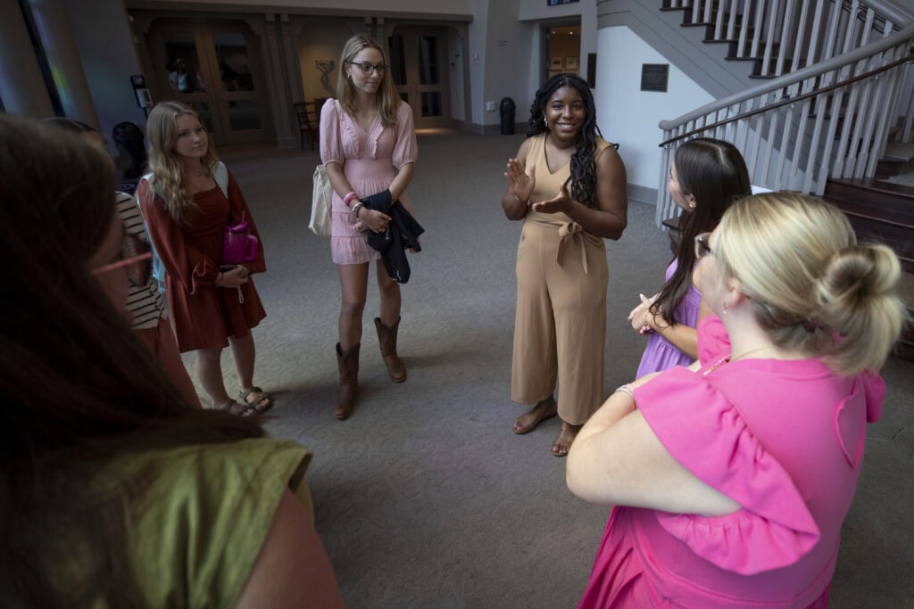 Purnell speaks to students in the lobby