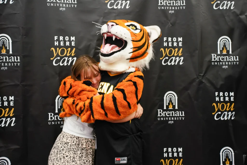 HJ hugging a student
