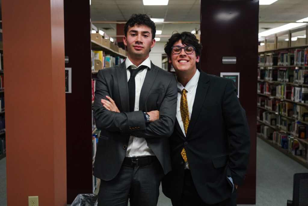 two students pose in between sessions