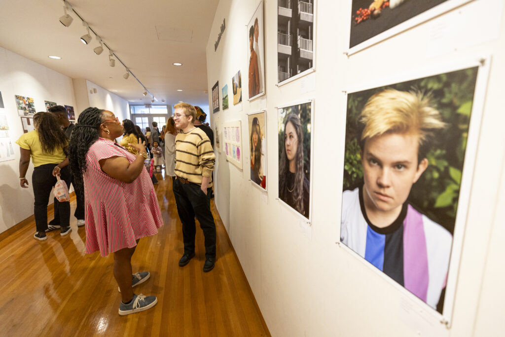 students and faculty at the exhibit
