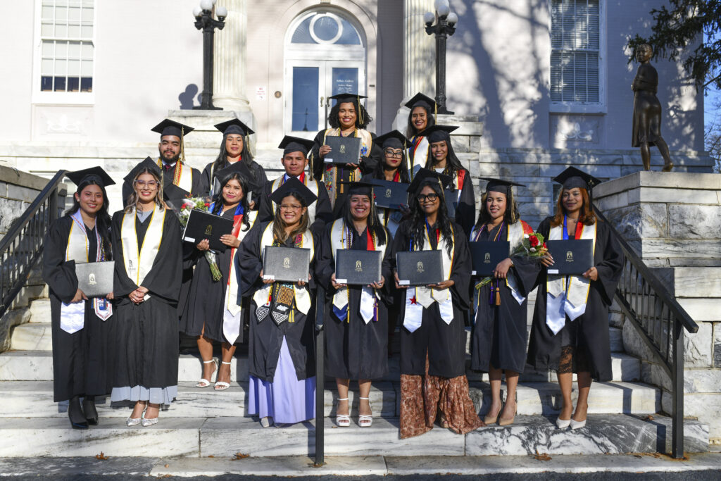 The first Panamanian cohort graduates, posed on the steps