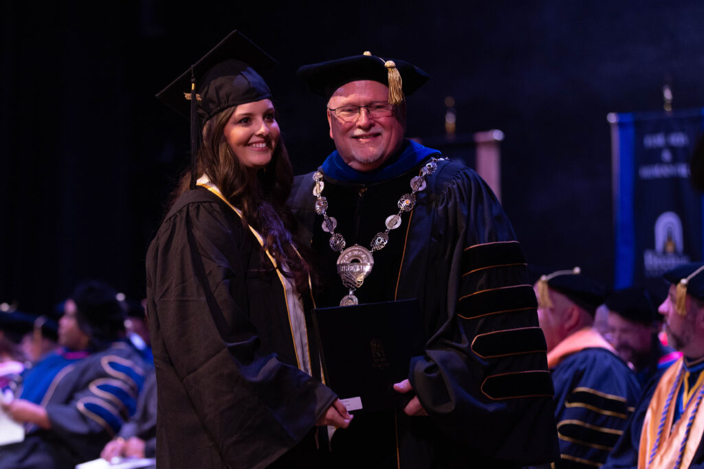 A graduate with Dr. Barnett