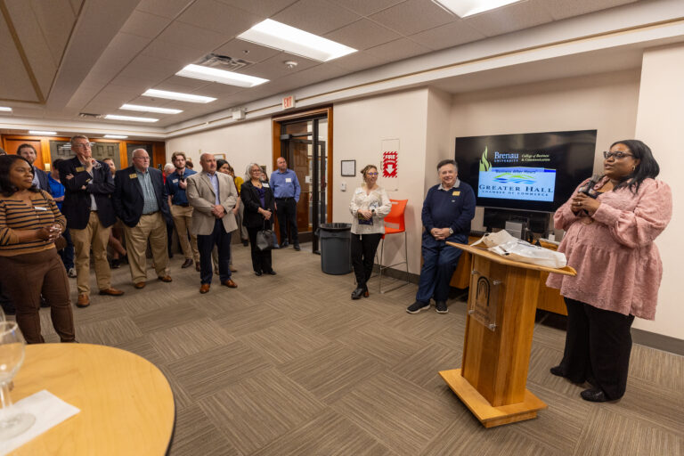 Dr. Shatrela Washington-Hubbard speaks to the crowd at Business After Hours