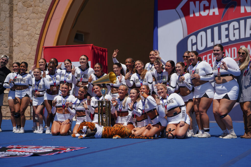 competitive cheer team on stage after winning