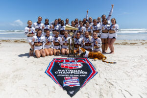 cheer team on beach with trophy an flag