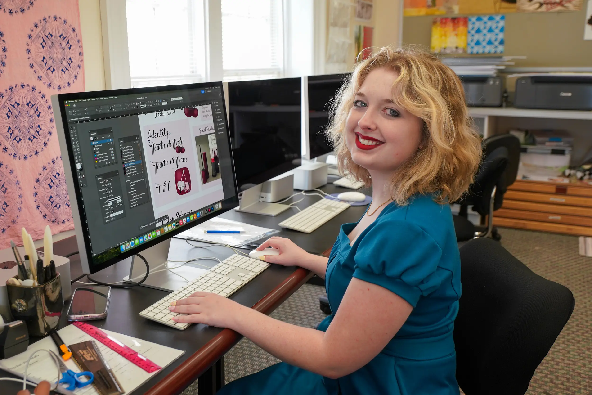 Aubrey, graphic design student, works on computer