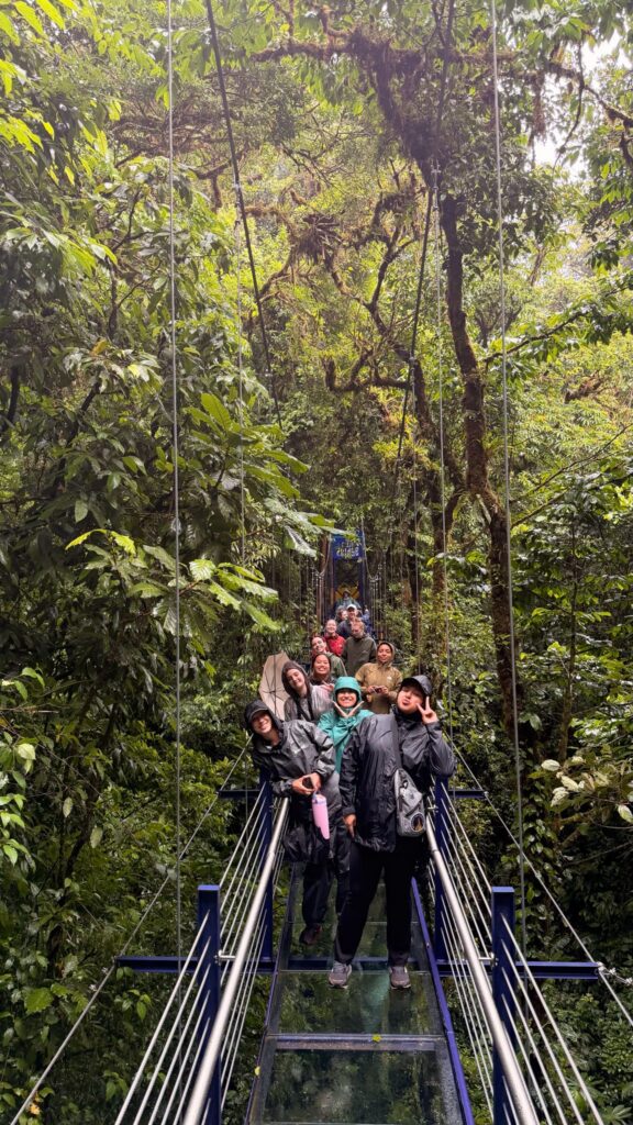 students and faculty on suspension bridge in Costa Rica rain forest