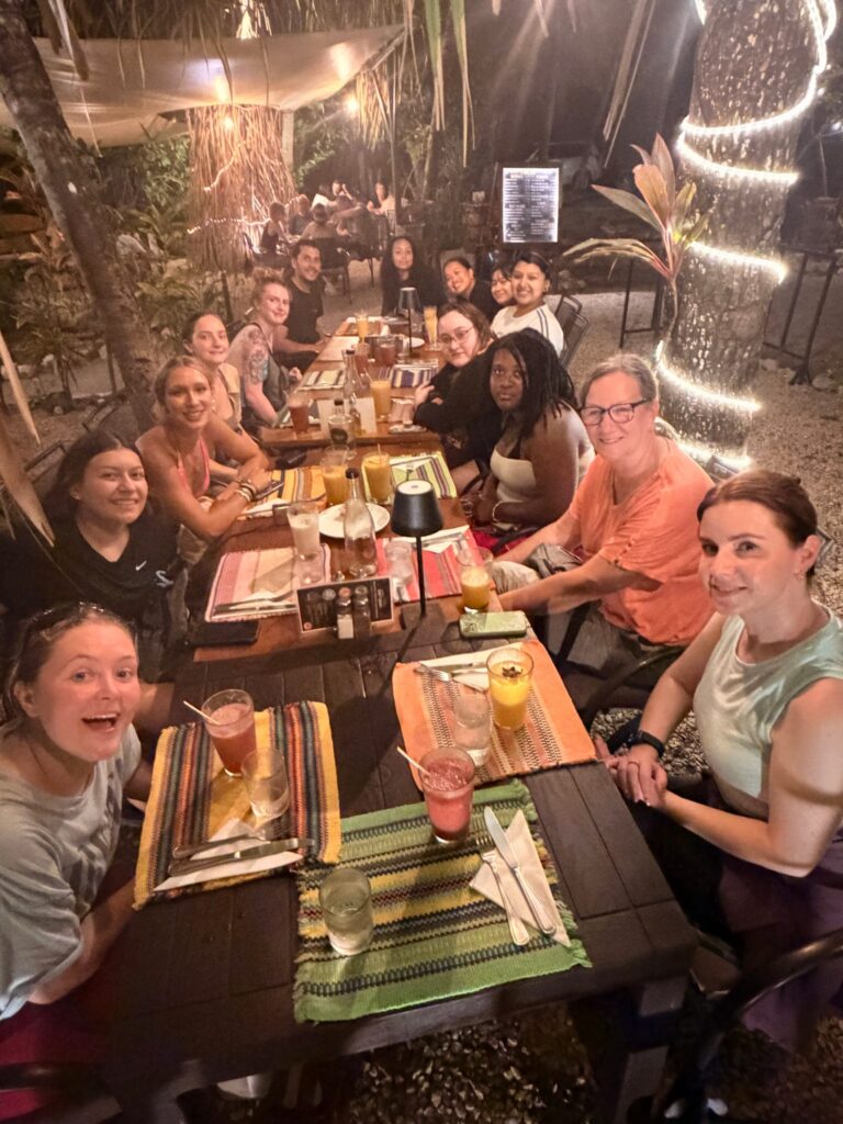 students and faculty have dinner in Costa rica