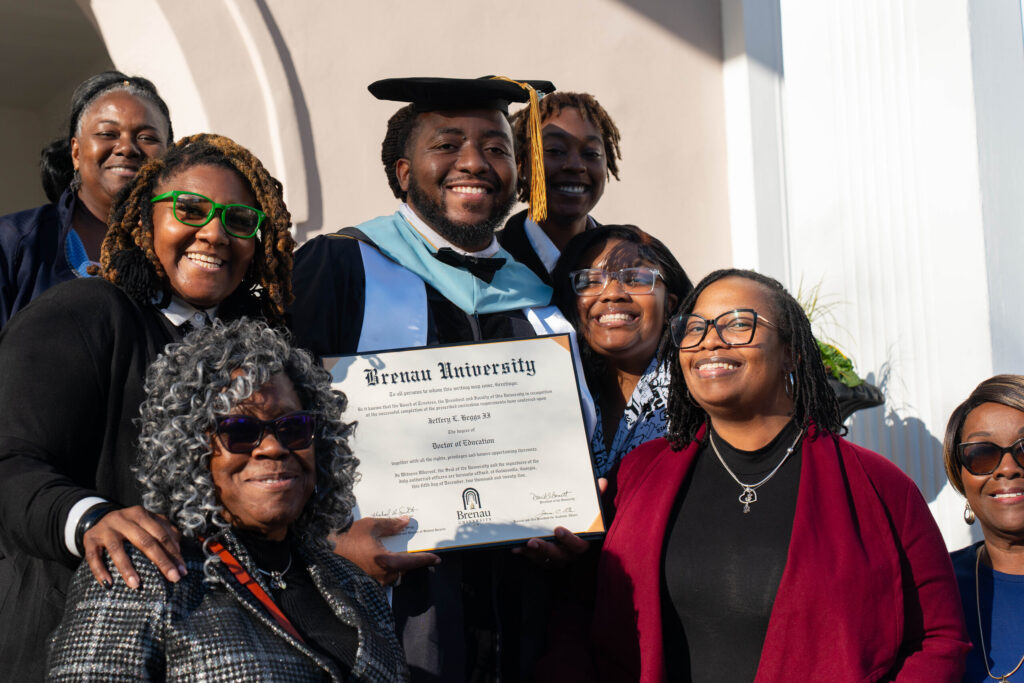 Jeffrey Heggs and family with his degree