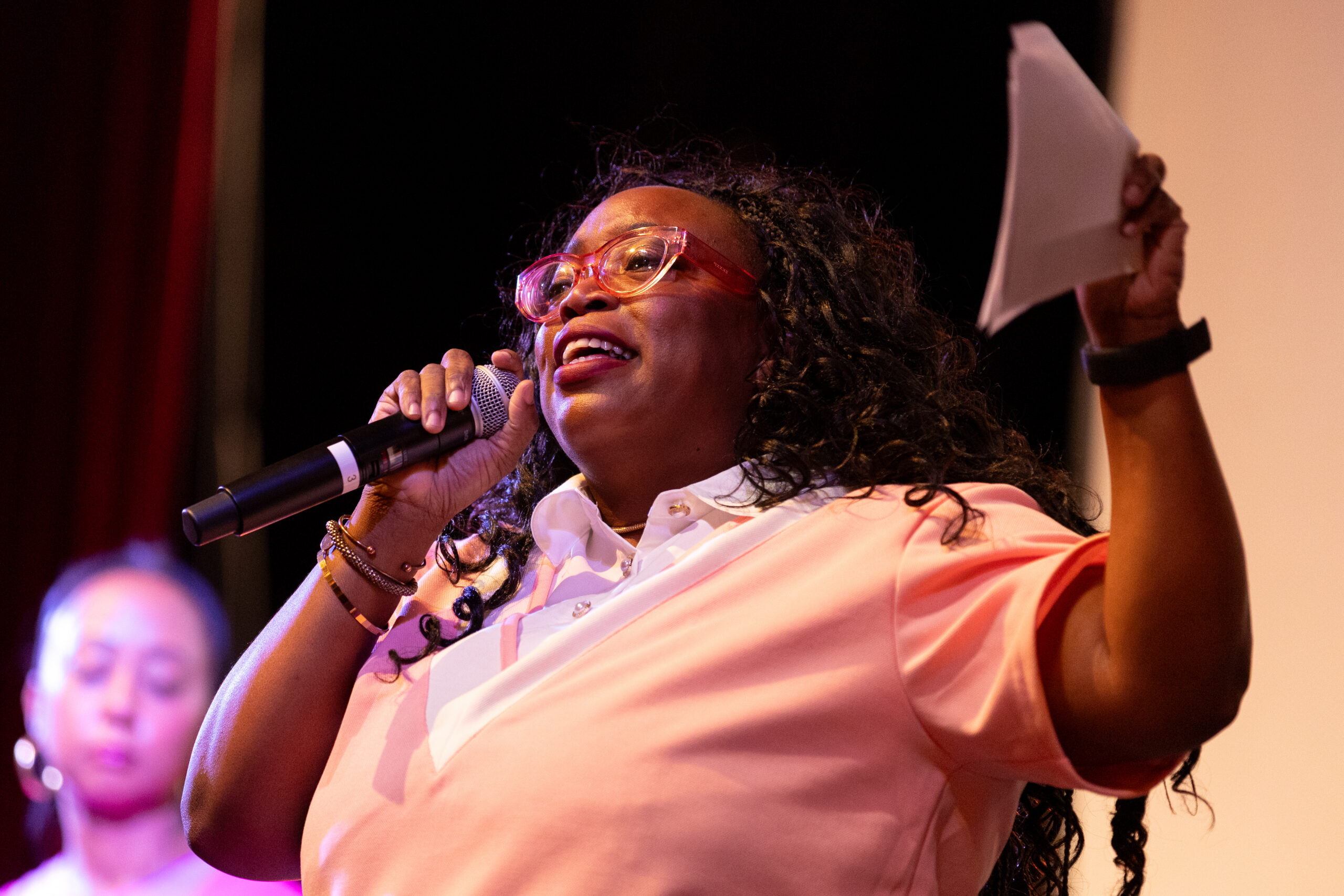 Madia Cooper-Ashirif speaks to a microphone during Tiger Power Hour.